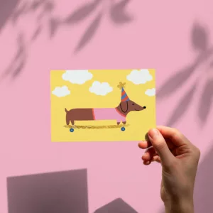 Carte postale - Teckel en skate